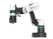 Load image into Gallery viewer, A DOBOT Magician 6-axis robotic arm with a white and black design, featuring a green light ring and a silver end-effector, shown against a solid white background. Has suction cup attached