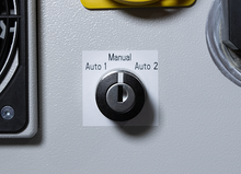 Load image into Gallery viewer, A close-up of a rotary control knob labeled 'Manual Auto 1 Auto 2' mounted on a light gray textured panel.