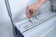 Load image into Gallery viewer, A close-up of a person's hand adjusting a clear acrylic guide ReadyCoilM