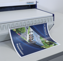 Load image into Gallery viewer, A FORMAX spiral-bound presentation binder is being fed through a FORMAX binding machine Wire200